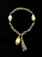TT original-Bracelet-Women's Gold Pearl Bracelet | Chunky-chain vintage design featuring pearls and tassel charms | Elegant, luxurious statement jewelry