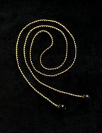 TT original-necklace-Understated luxury black and gold necklace | Gold braided long chain | Black gemstone tassel pendant | Stackable light luxury necklace
