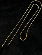 TT original-necklace-Understated luxury black and gold necklace | Gold braided long chain | Black gemstone tassel pendant | Stackable light luxury necklace