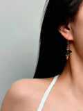 TT original-earring-Black onyx gold pendant earrings | Elegant and unique women's jewelry | French hook-shaped lantern pendant earrings
