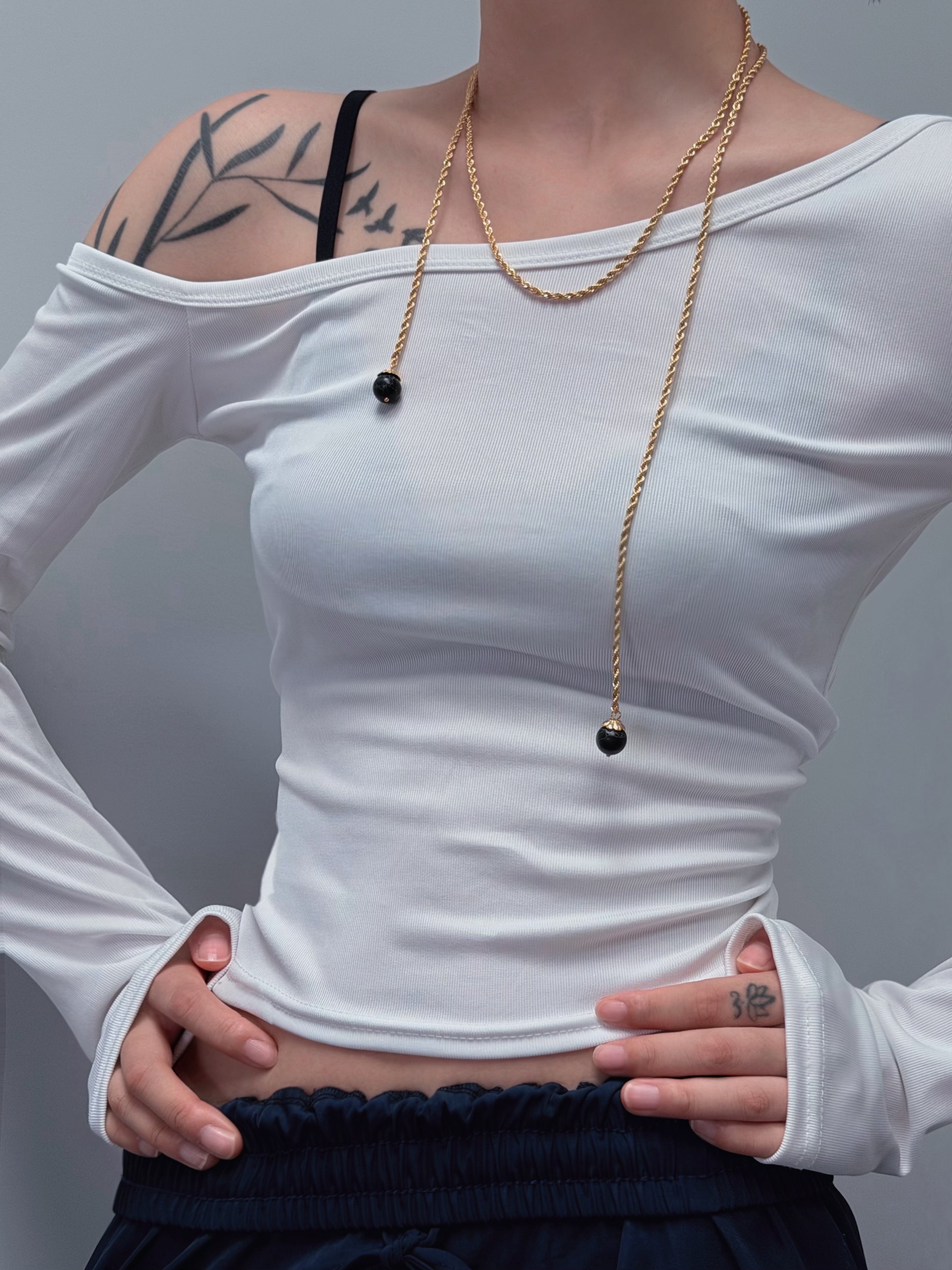 TT original-necklace-Understated luxury black and gold necklace | Gold braided long chain | Black gemstone tassel pendant | Stackable light luxury necklace