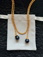 TT original-necklace-Understated luxury black and gold necklace | Gold braided long chain | Black gemstone tassel pendant | Stackable light luxury necklace