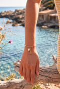 Gold Tassel Pearl Bracelet worn on the wrist