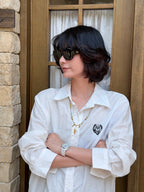 Natural stone Bohemian feather necklace worn with a -casual outfit