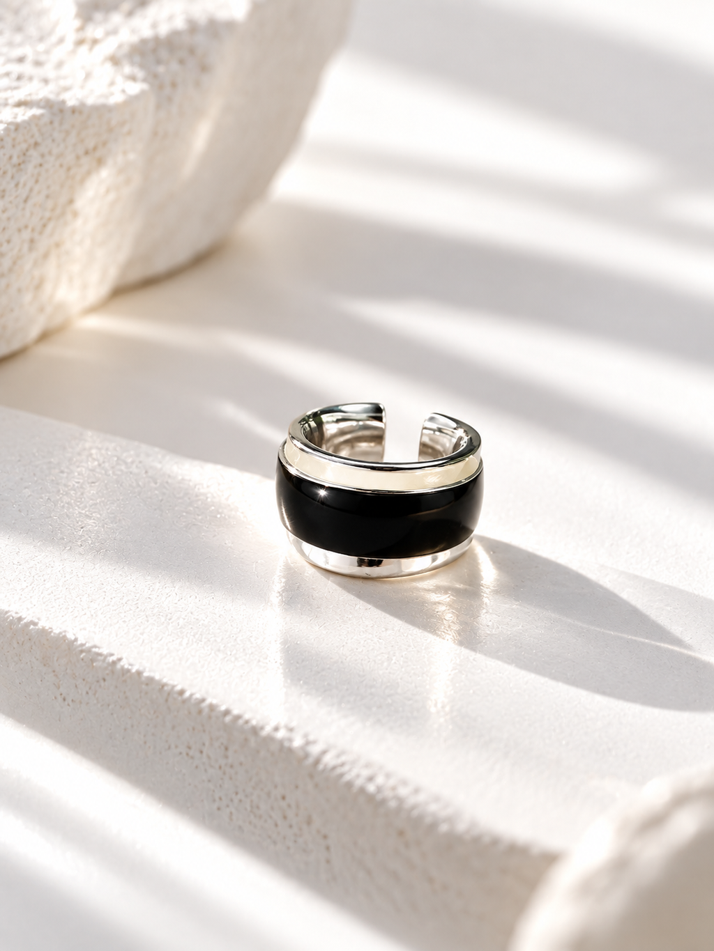 Adjustable open band on two-tone enamel ring