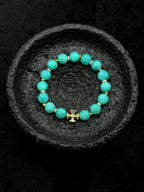 Blue green natural amazonite beads with gold cross bracelet detail
