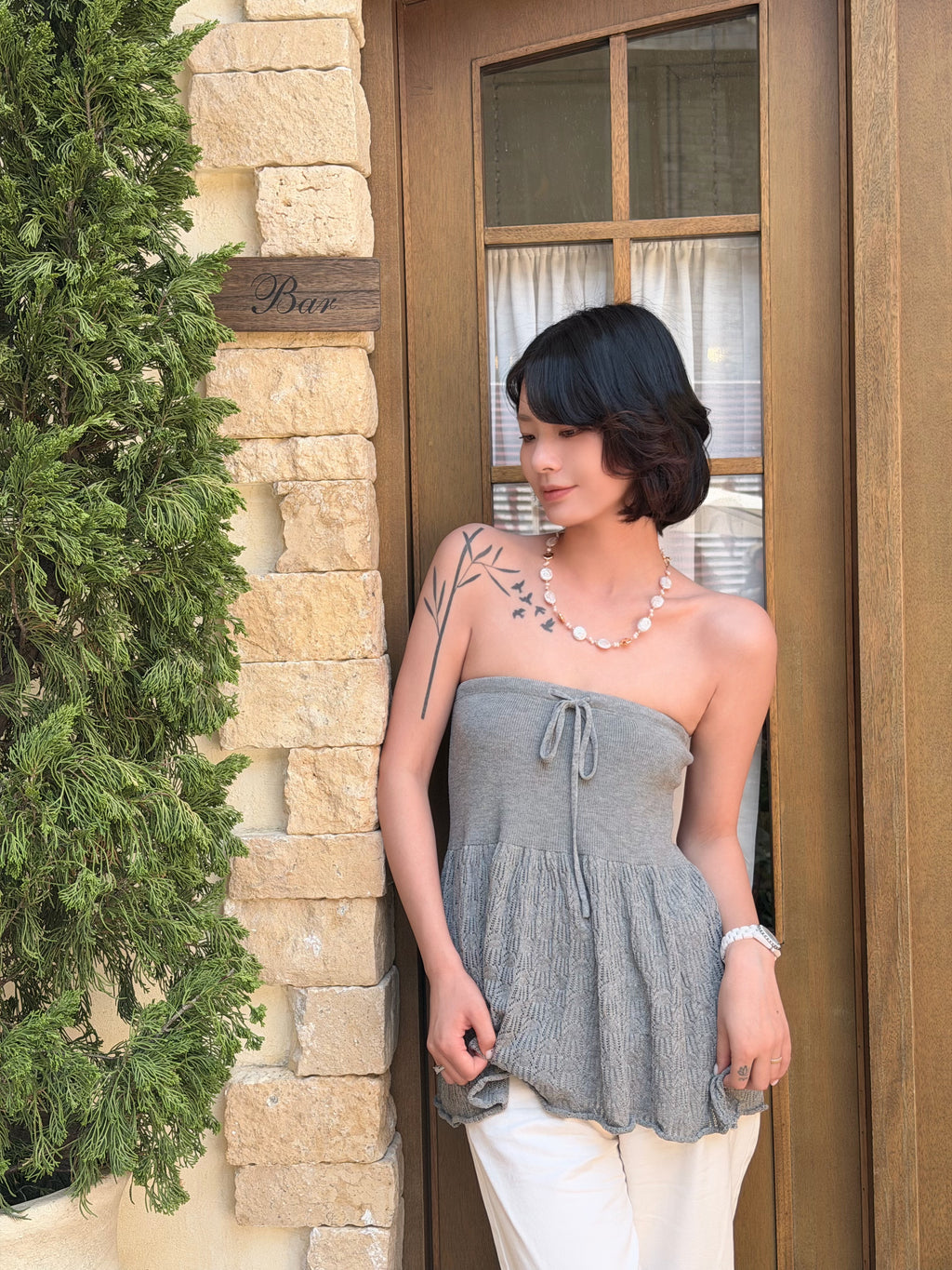 Baroque pearl coin necklace styled on the neckline