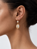 woman wearing baroque pearl drop earrings