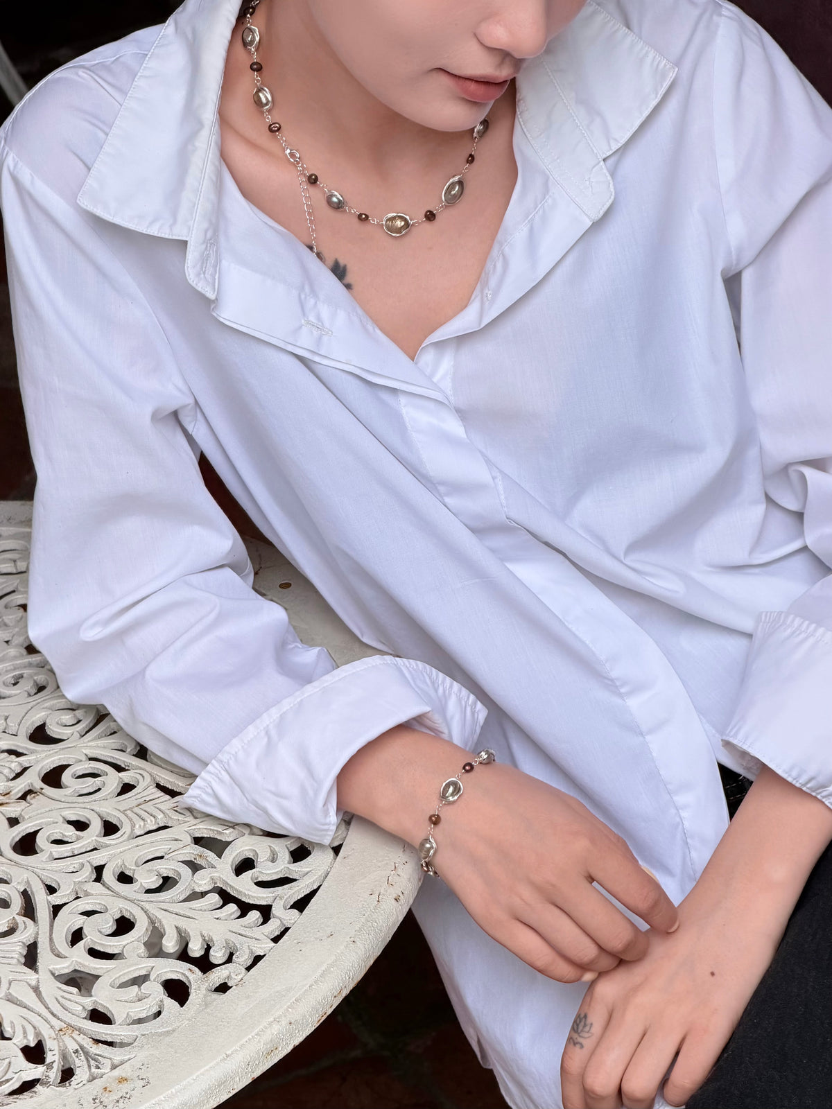 Baroque pearl necklace bracelet set worn around the neckline and wrist