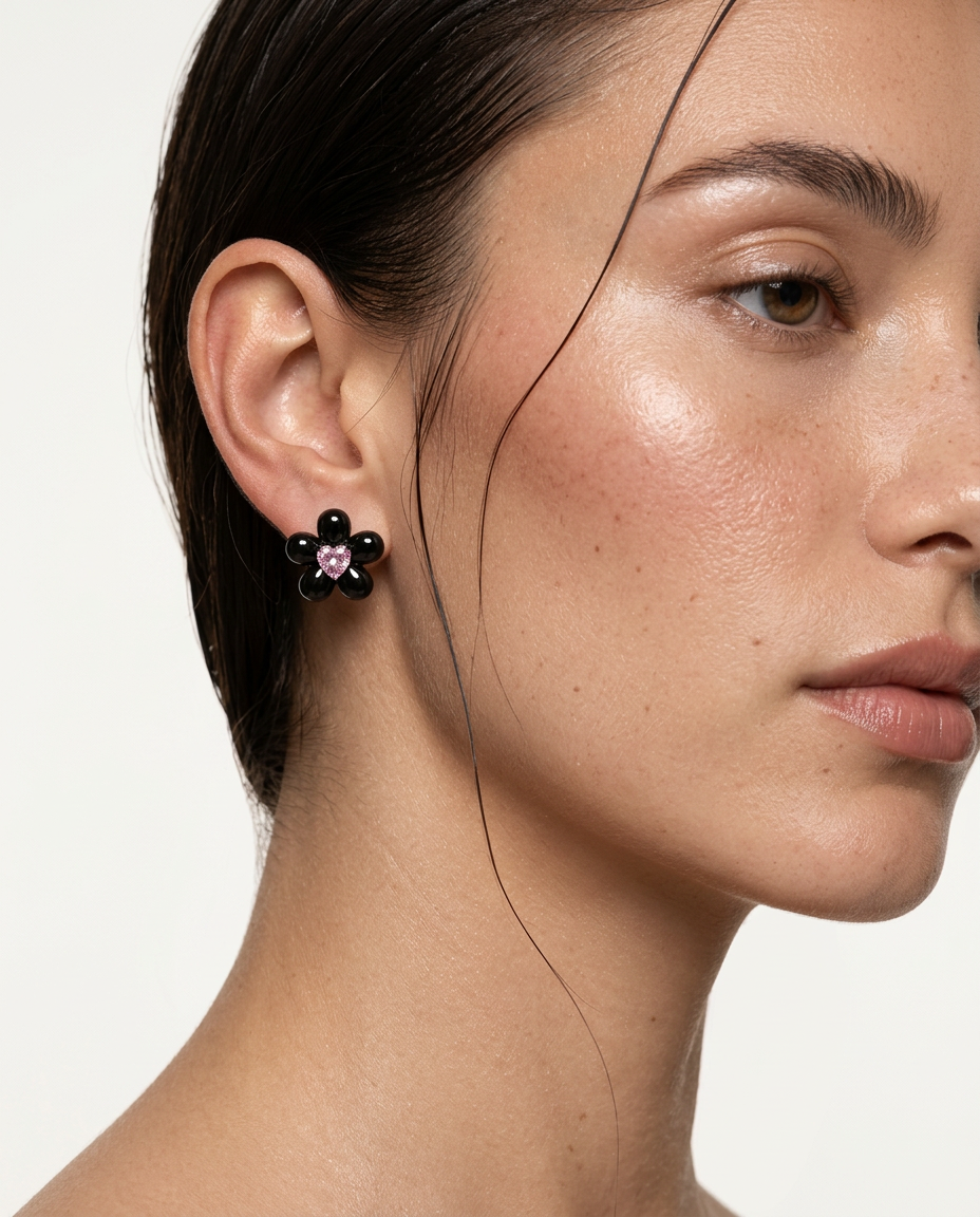 woman wearing black flower stud earrings