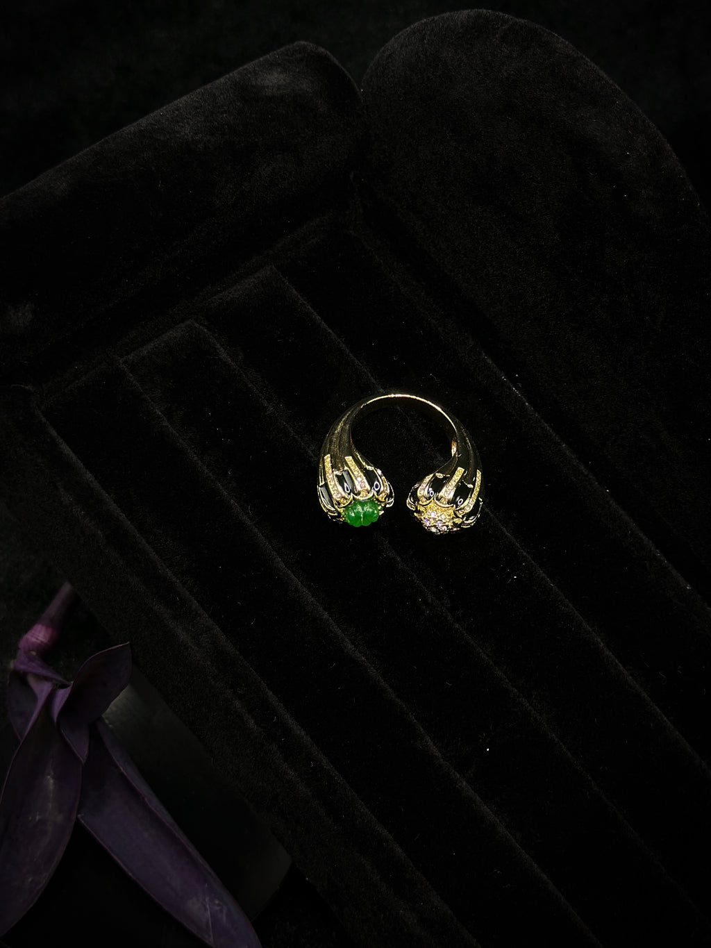 Side view of black and gold statement ring