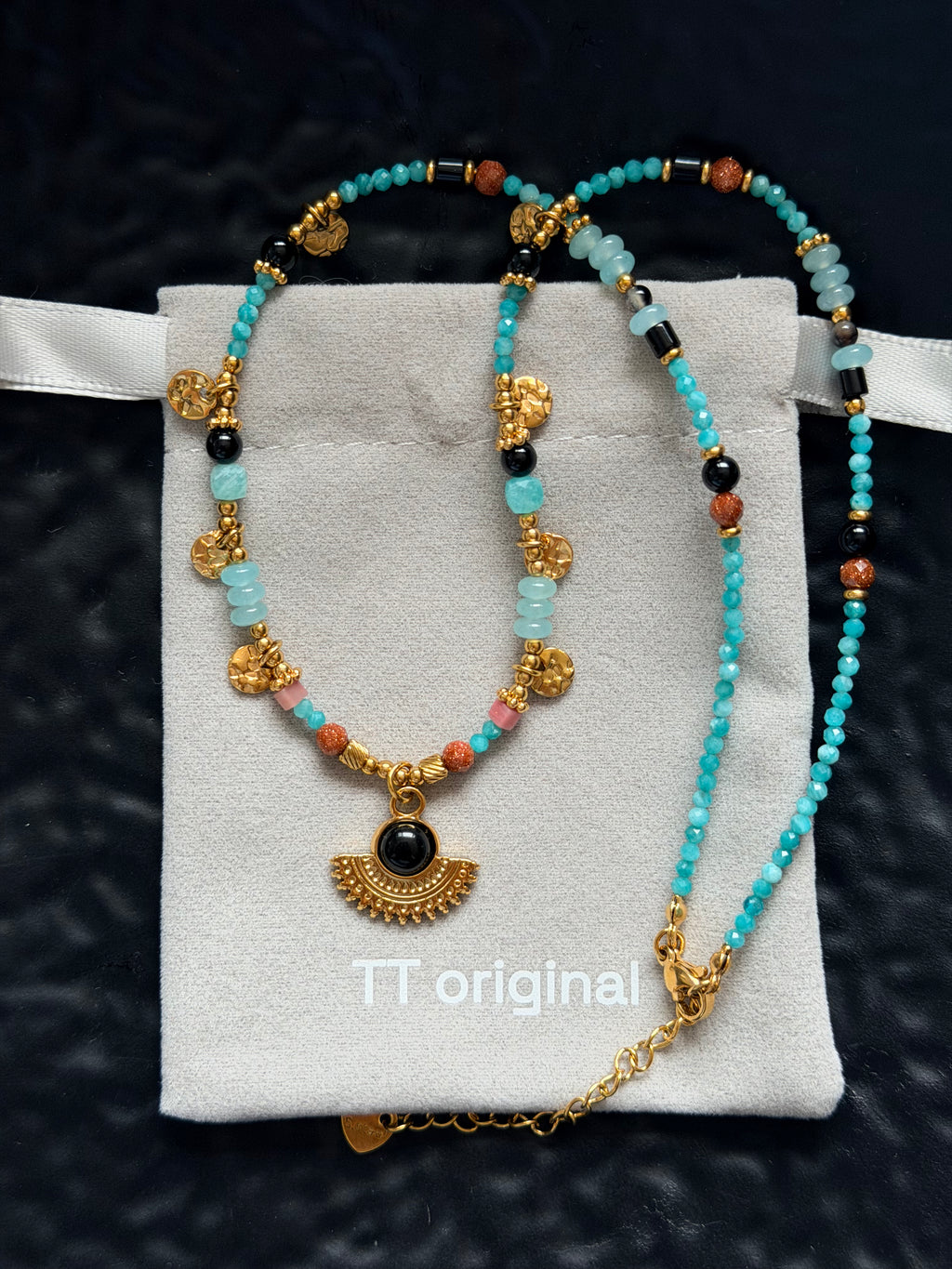 Blue-green beaded crescent necklace