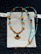 Blue-green beaded crescent necklace