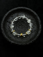 Clear white crystal bead bracelet with gold-tone details