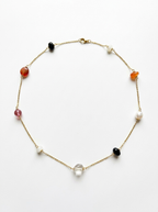 Colorful stone arrangement on long necklace