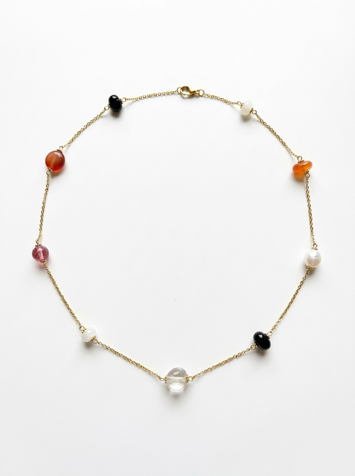 Colorful stone arrangement on long necklace