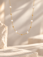 Natural freshwater pearls with fine gold thread detail