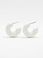 diamond patterned texture on white hoop earrings