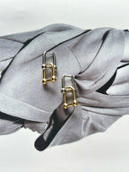 sculptural gold lock earring detail
