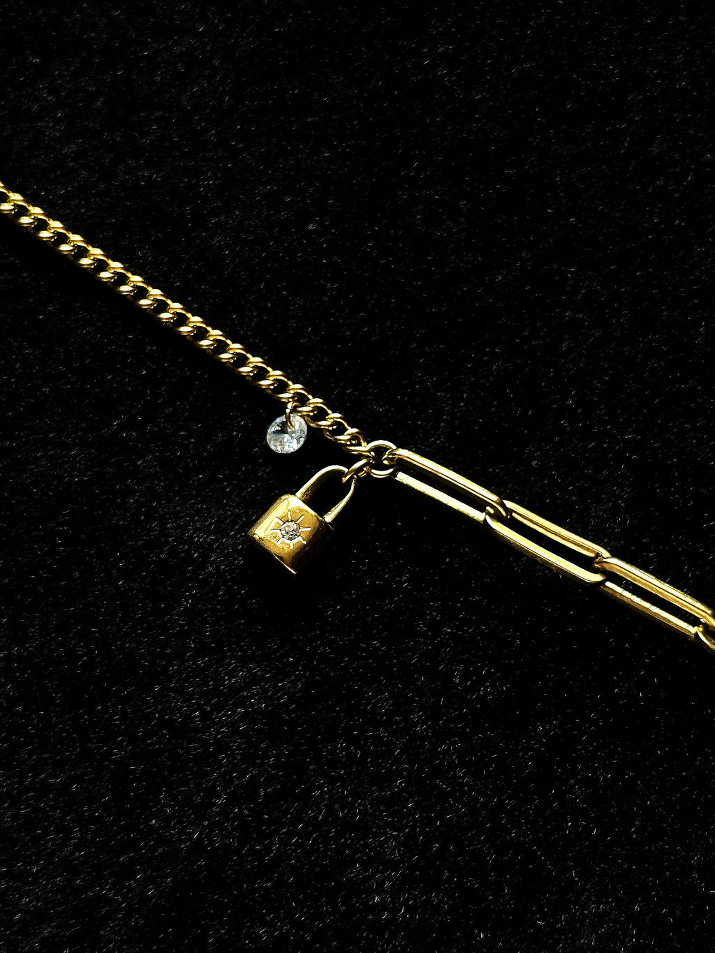 Close-up of the gold padlock detail on the bracelet