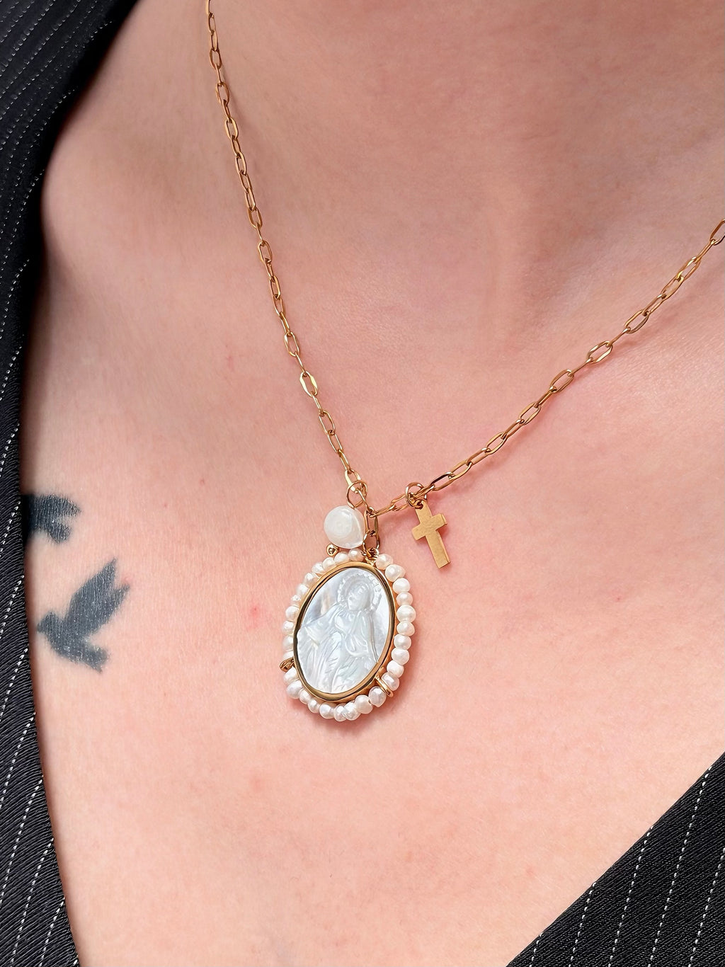 Gold paperclip chain on vintage Virgin Mary necklace