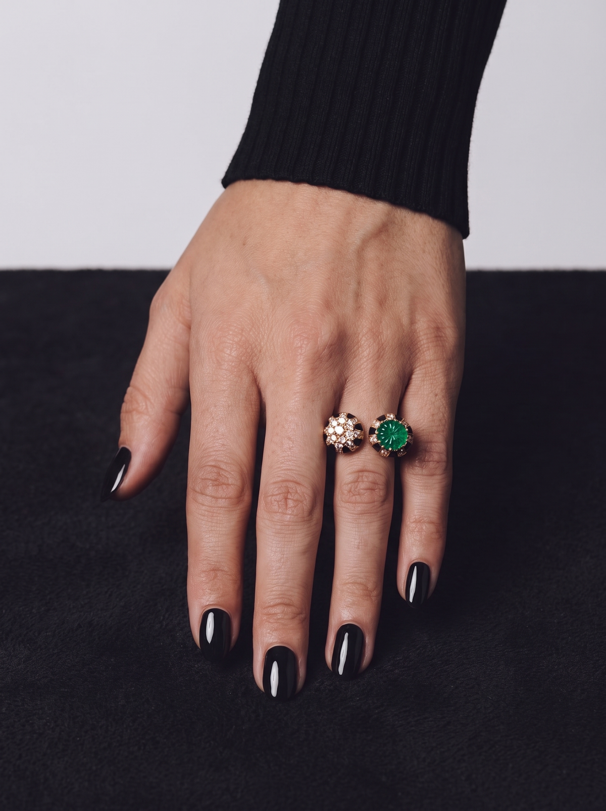 Green stone black and gold statement ring worn on finger