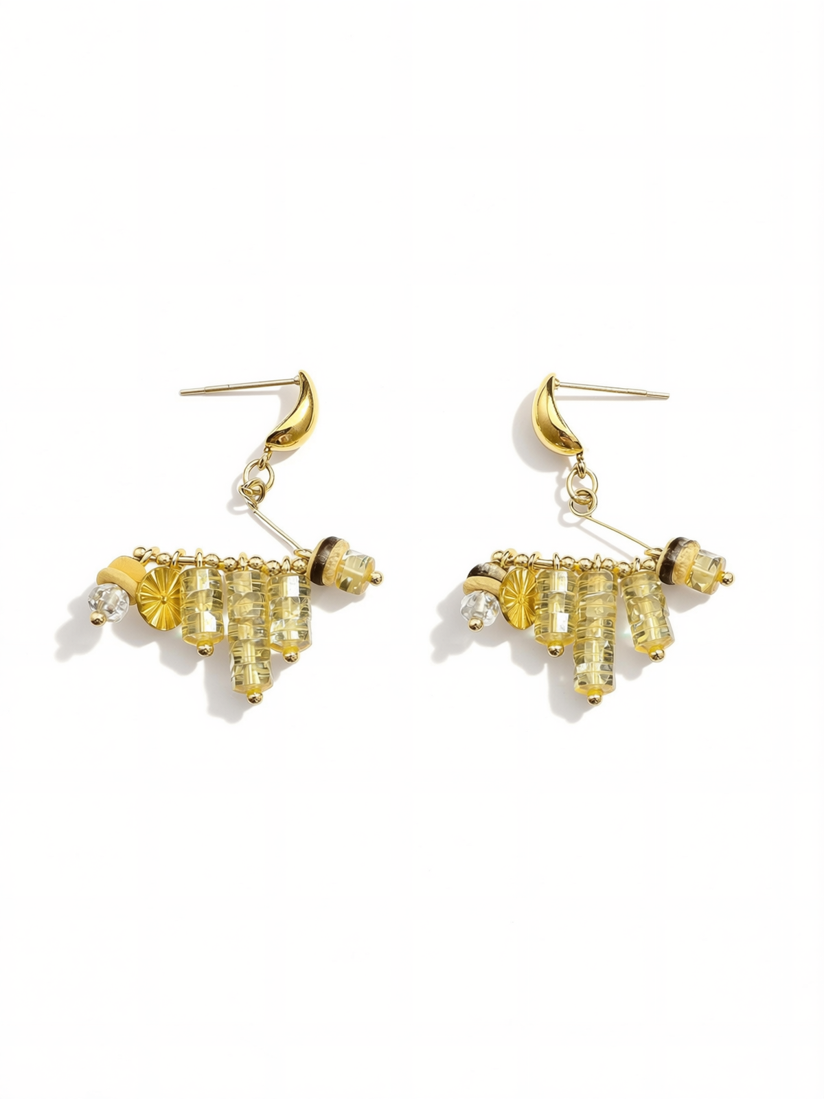 Close-up of natural stone and gold bead details on tassel earrings