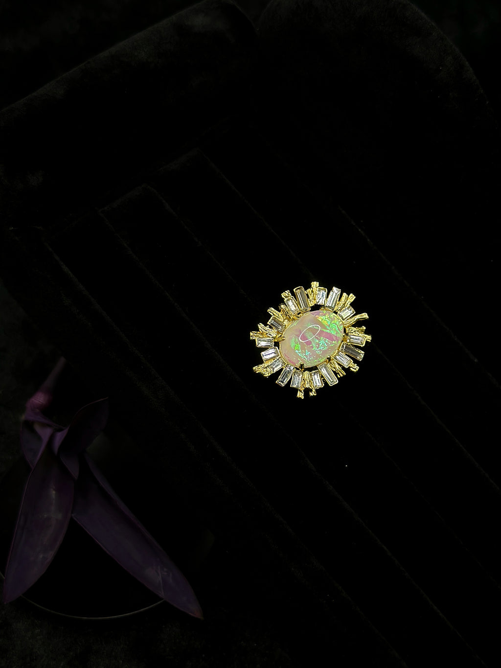 Iridescent center stone with green pink and gold tones