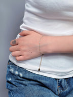 Light blue gold bracelet worn on the wrist