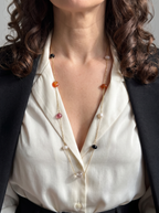 Long natural stone necklace worn as a single strand