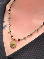 Mixed beads and gold details on statement necklace