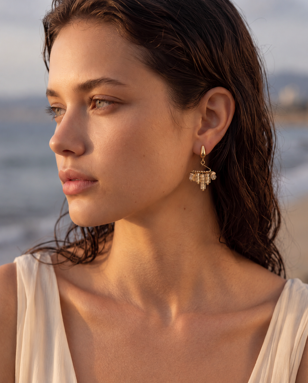 Woman wearing handmade bohemian natural stone tassel earrings