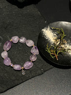 Natural amethyst bead with unique purple texture and inclusions