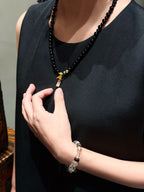 Natural black agate necklace worn around the neckline