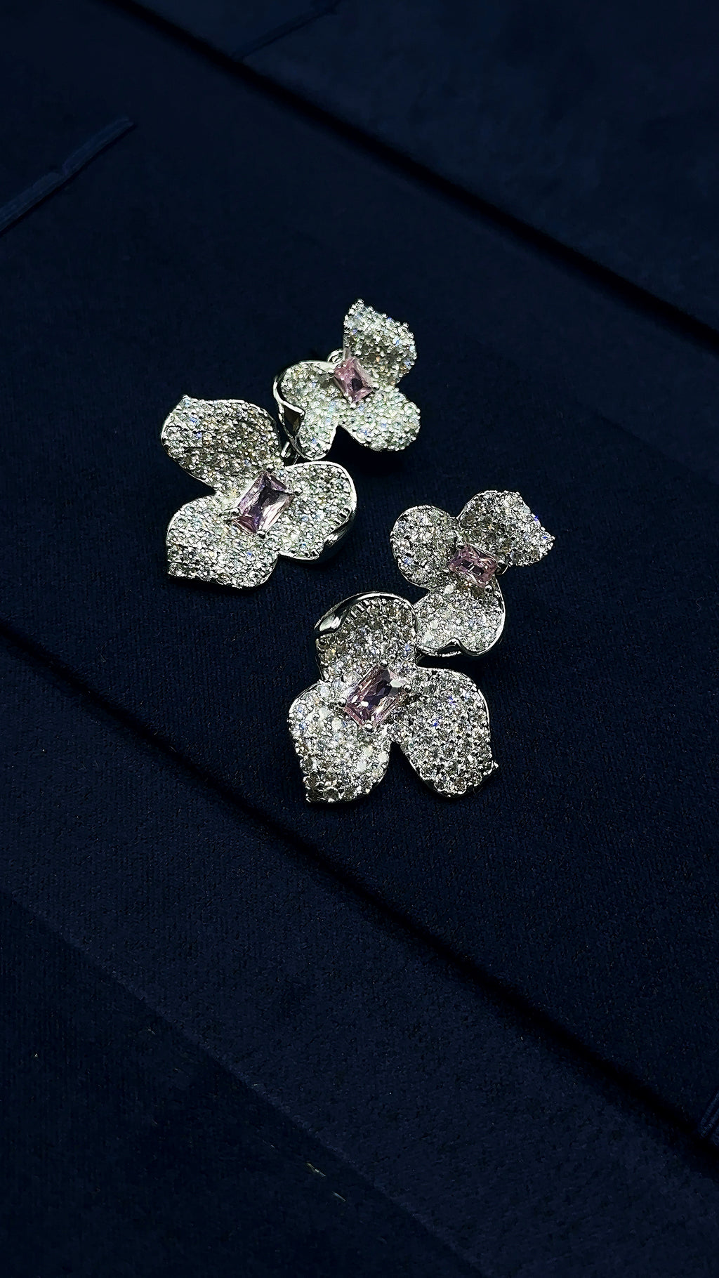 pink teardrop center stone on flower earrings