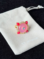 Side view of sculptural pink spiral ring