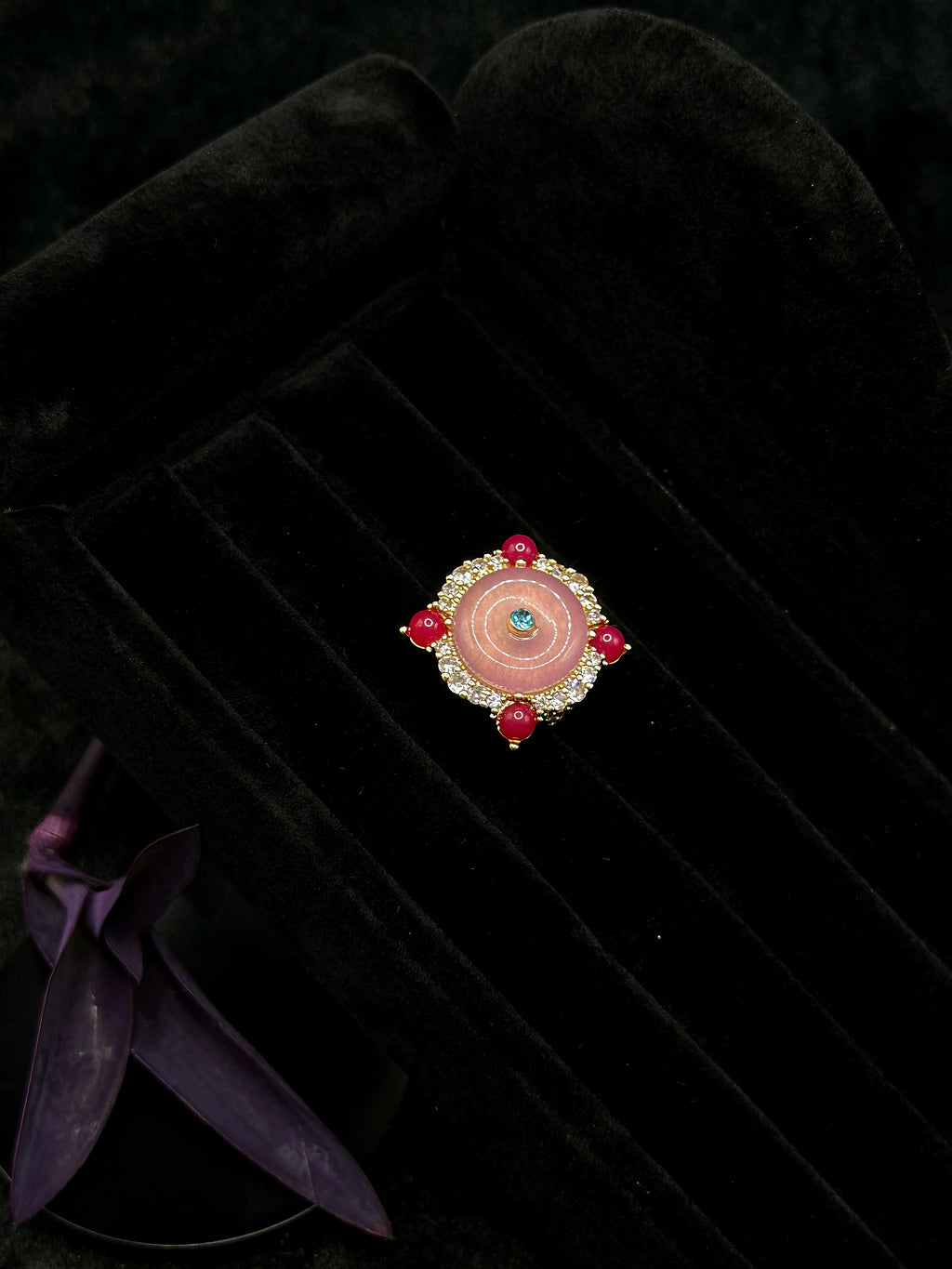 Pink spiral statement ring with colorful center