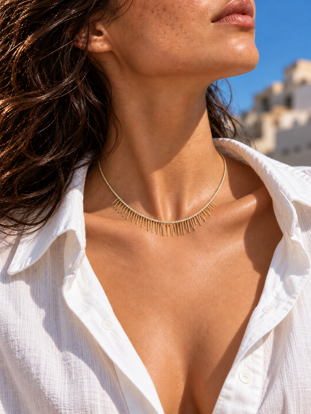 Rhinestone tassel necklace worn around the collarbone