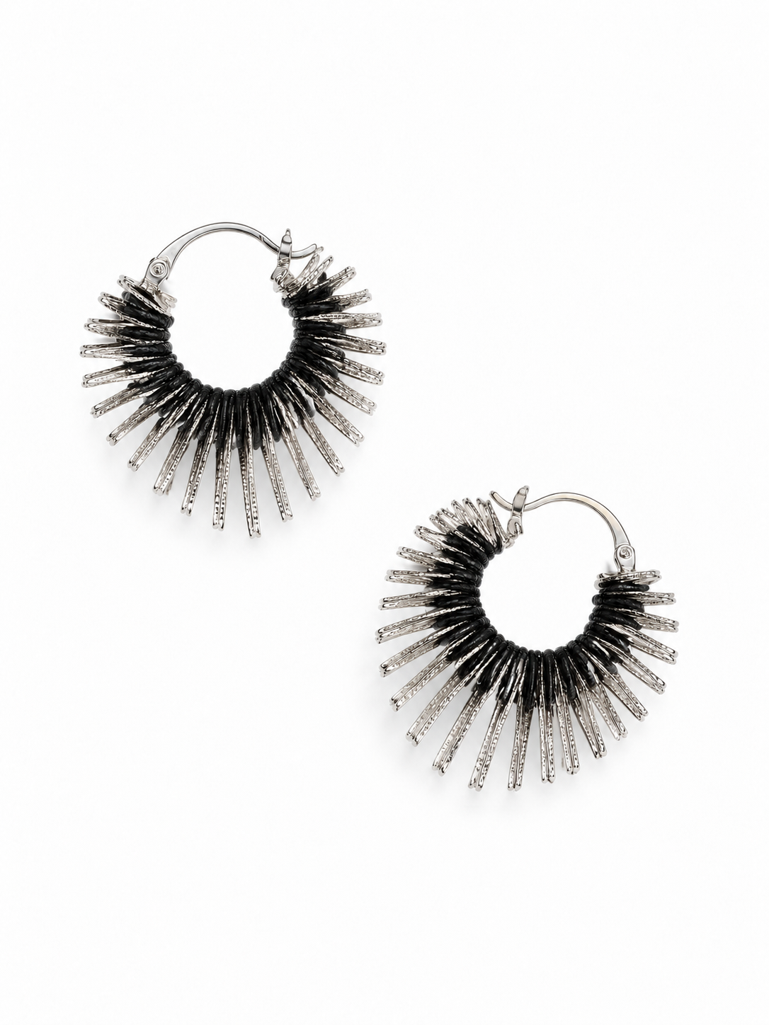 sculptural silver heart earrings with black leather cords