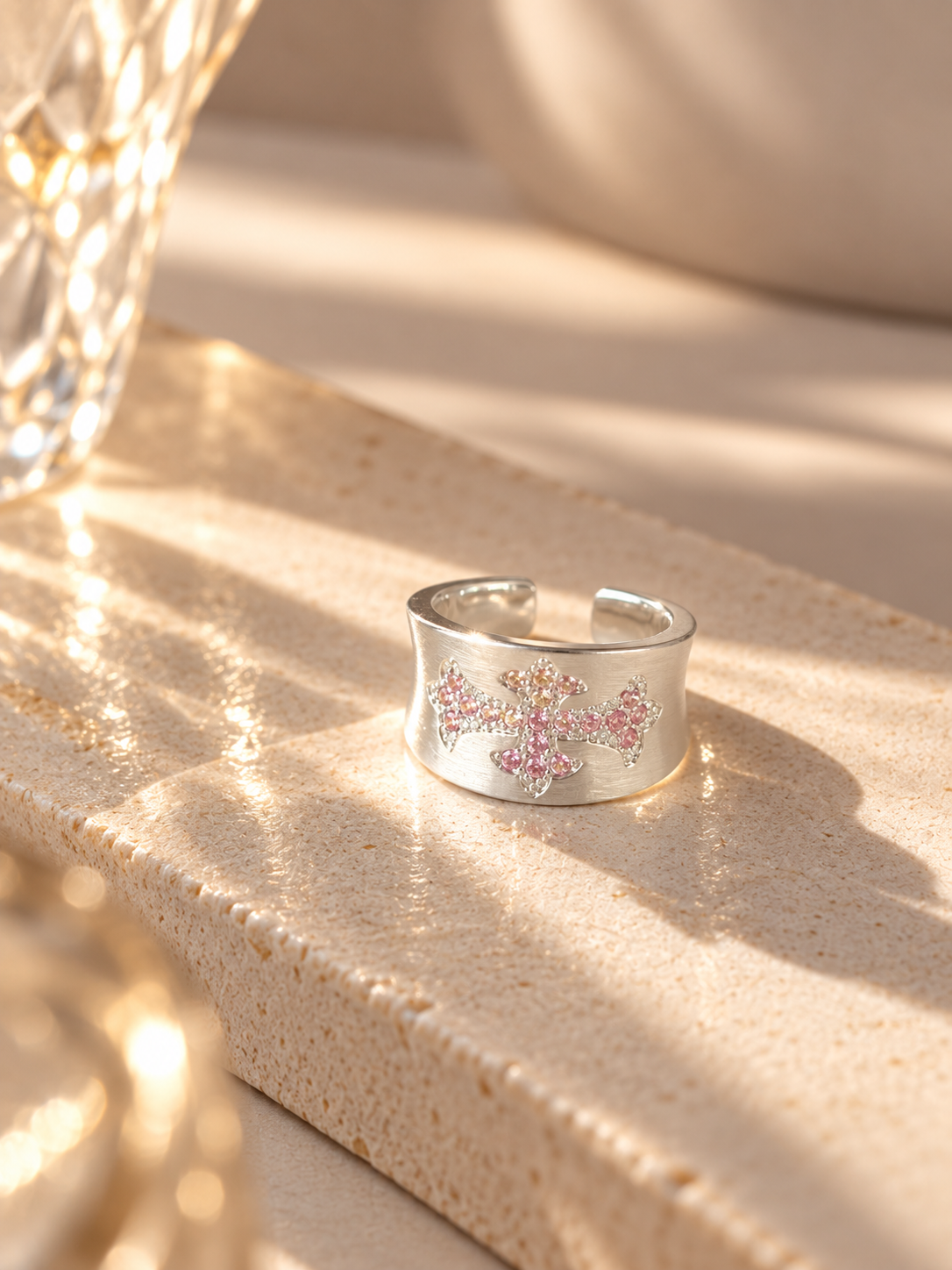 Sculptural cross detail on silver statement ring