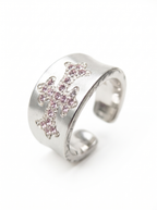 Pink accent details on silver cross ring