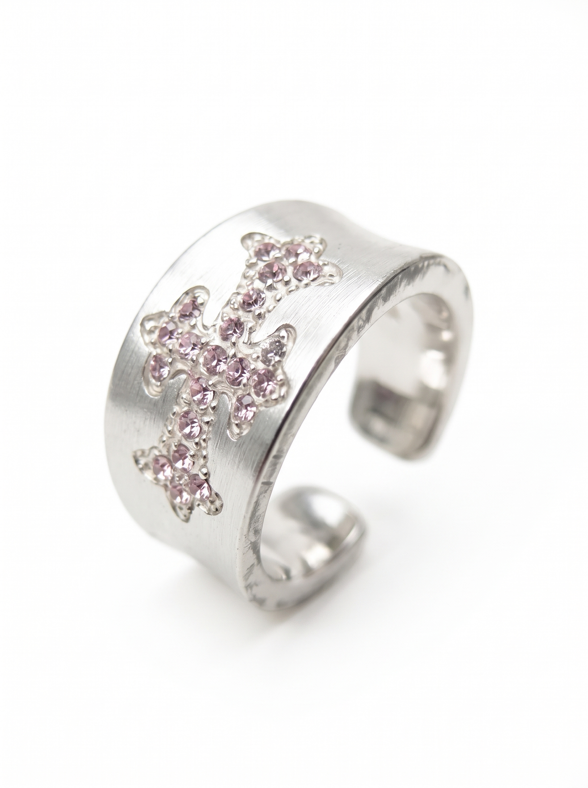 Pink accent details on silver cross ring