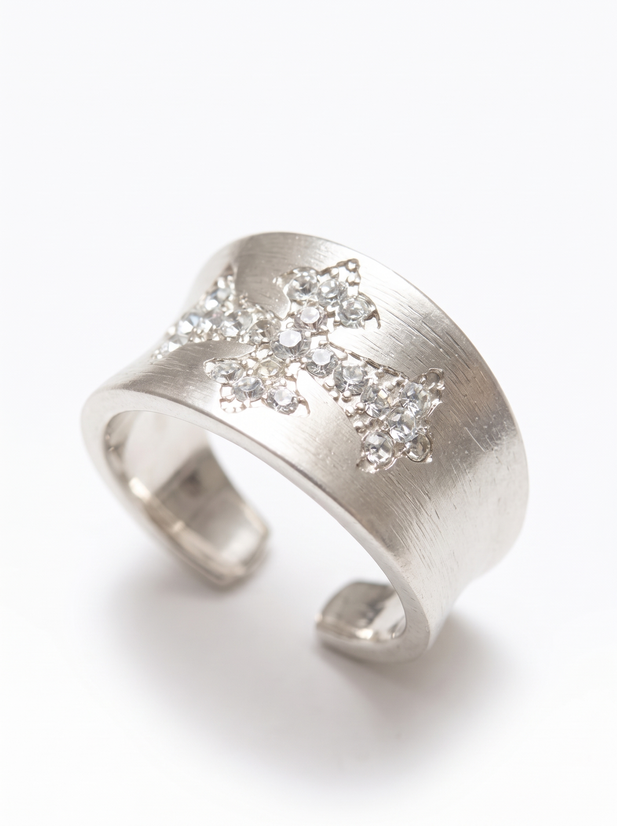 white accent details on silver cross ring