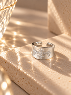 Silver cross statement ring with wide band
