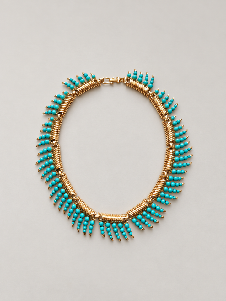 Vintage gold faux turquoise necklace on a pearl gray background