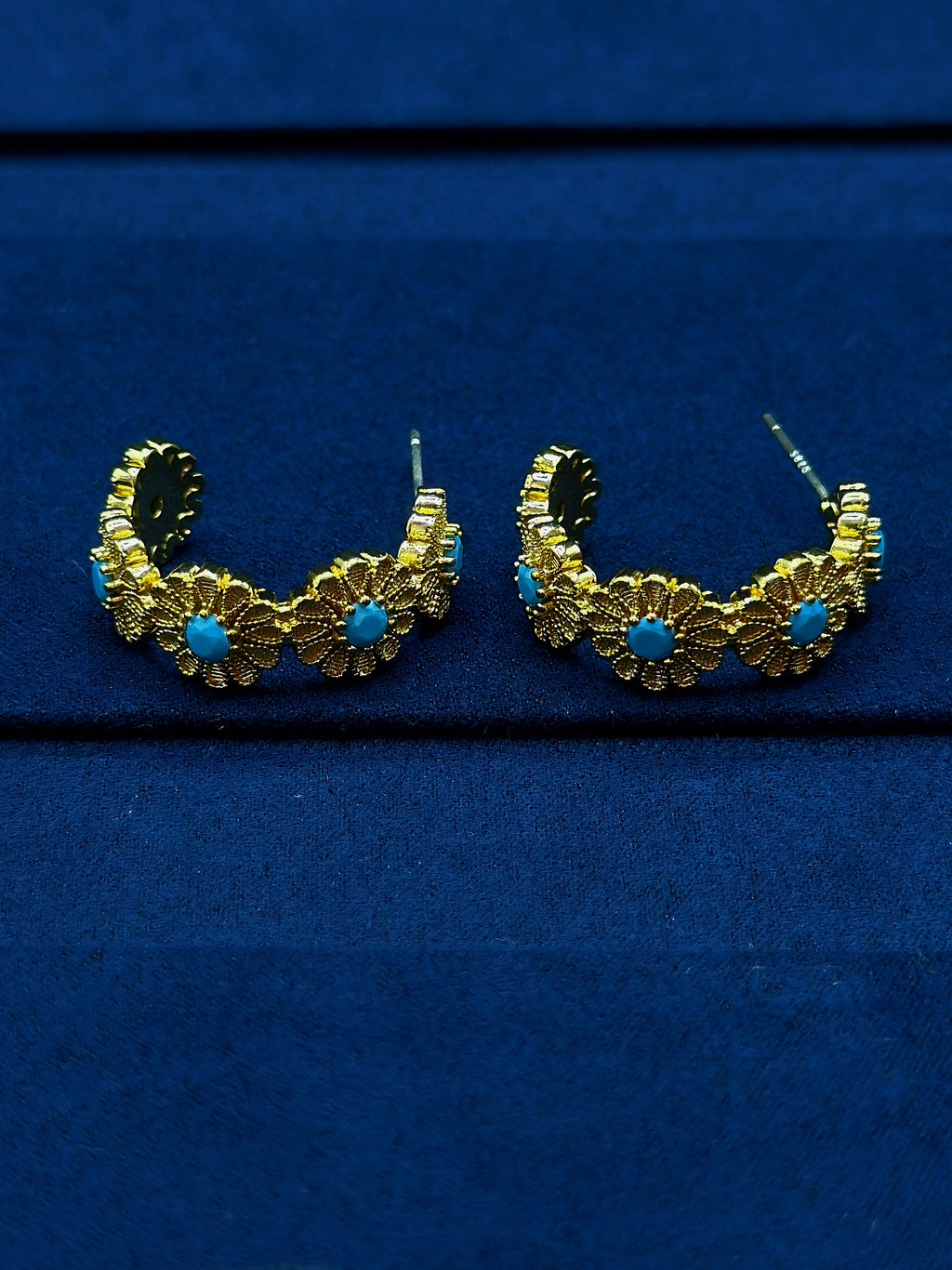 embossed texture on turquoise gold earrings