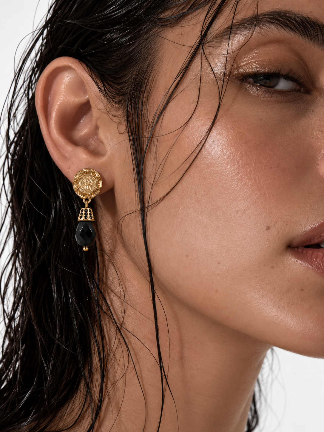 woman wearing vintage black and gold drop earrings
