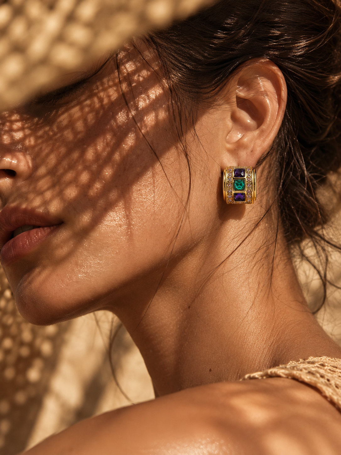woman wearing vintage colorful gold hoop earrings