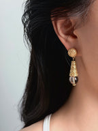 embossed floral detail on vintage gold earrings