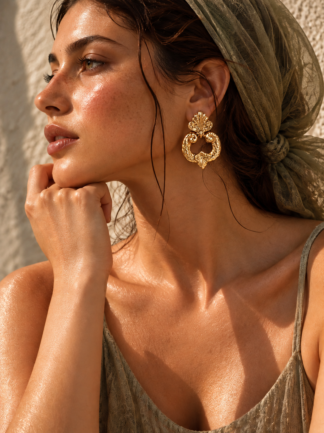 woman wearing vintage gold leaf earrings